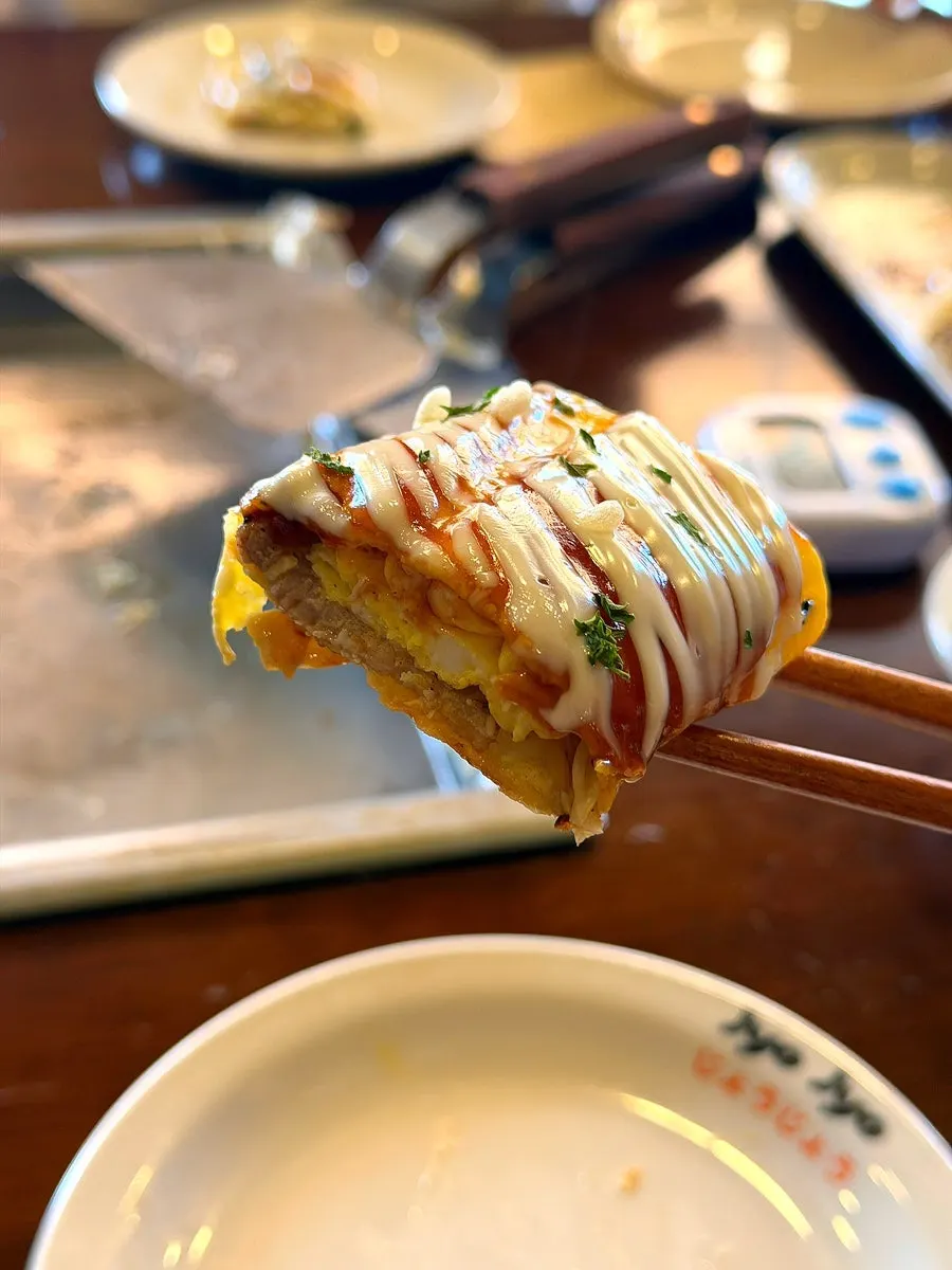 Cross-section of donpeyaki with pork belly and egg