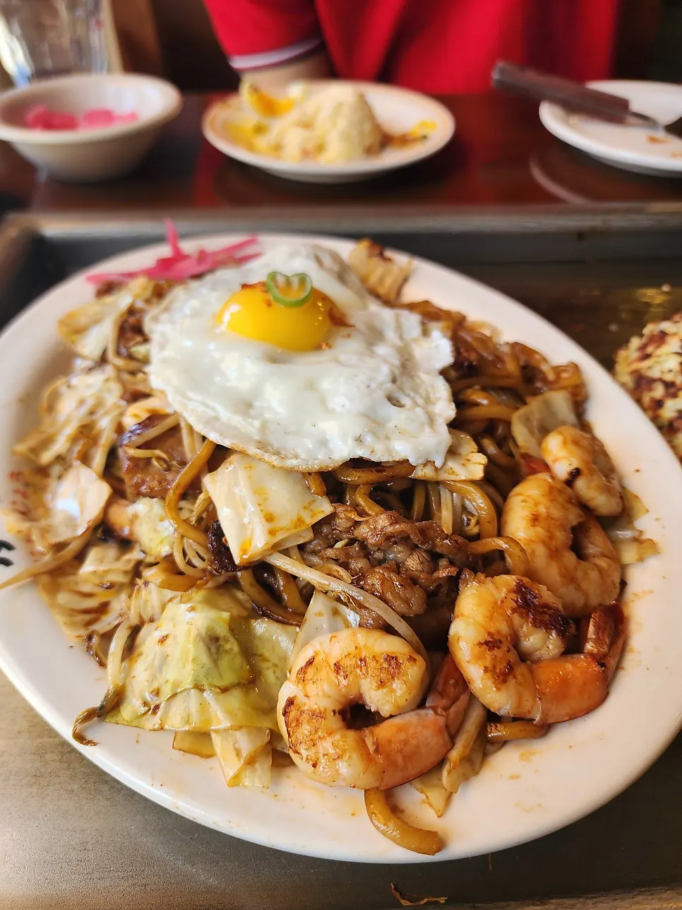 Jojo yakisoba double topped with whole shrimp and a fried egg