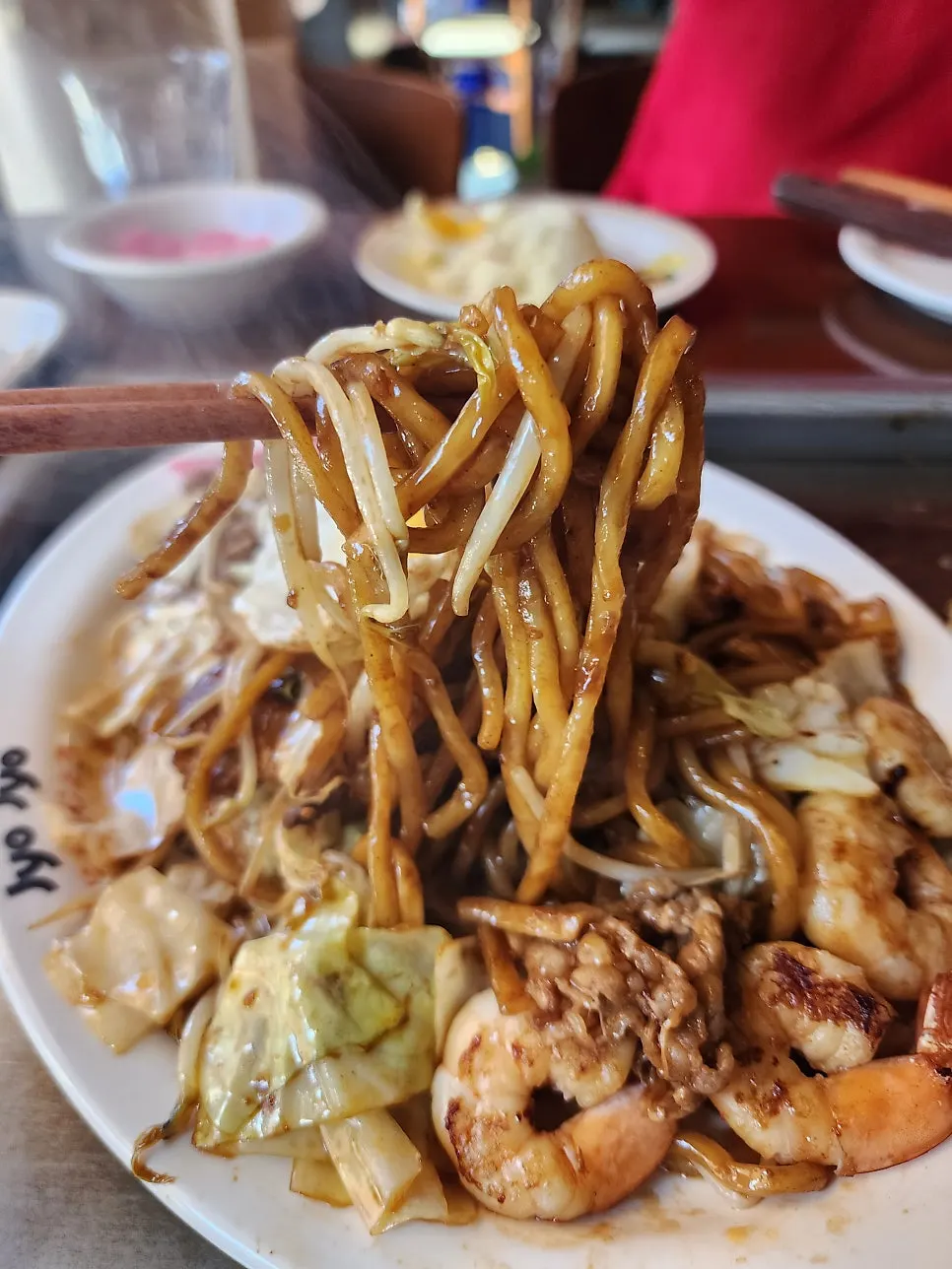 Yakisoba noodles mixed with egg yolk and bean sprouts