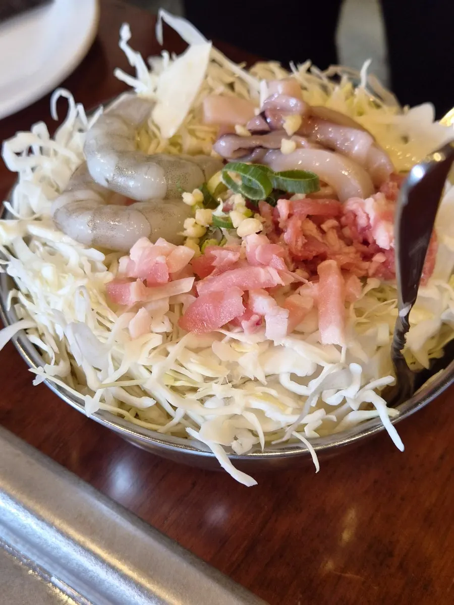 Jojo okonomiyaki topped with bonito flakes