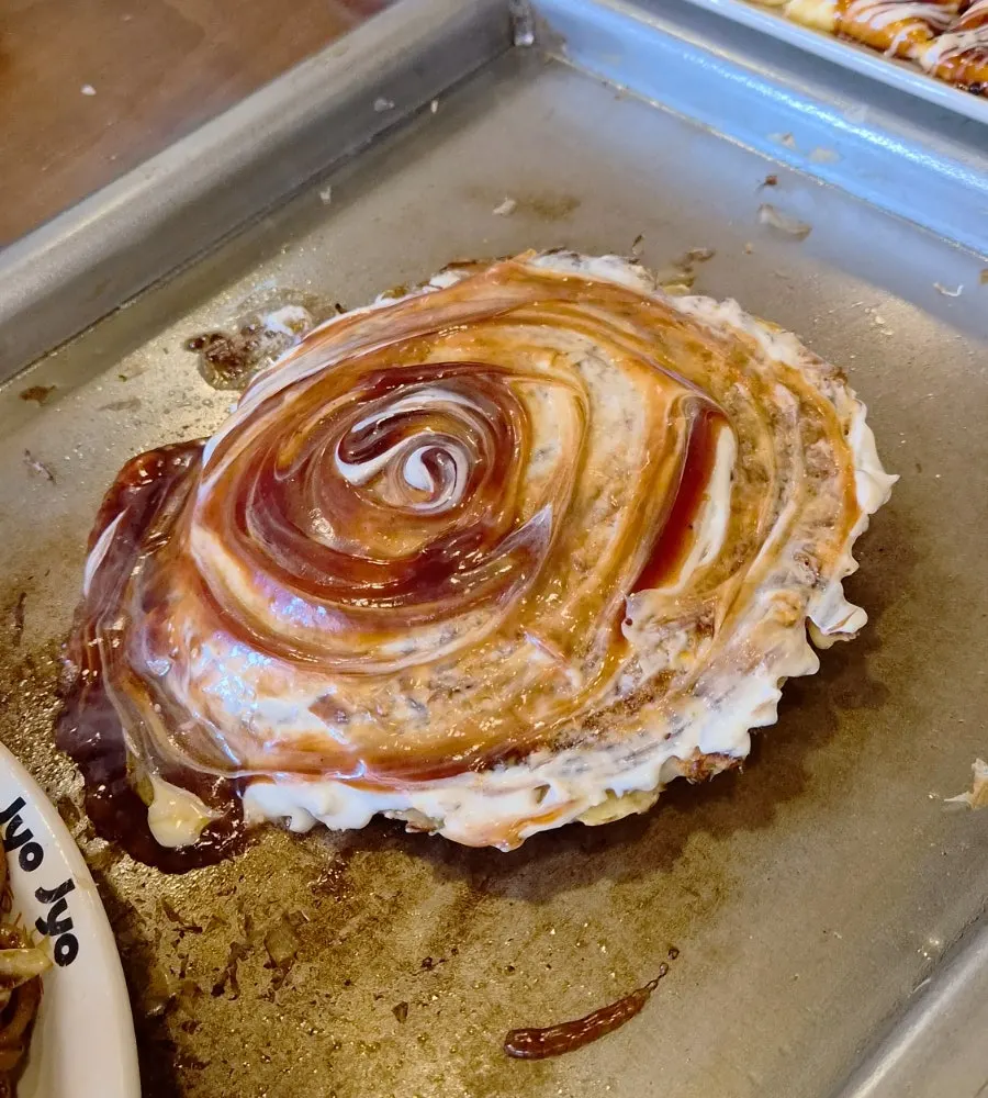 A finished serving of Jojo okonomiyaki