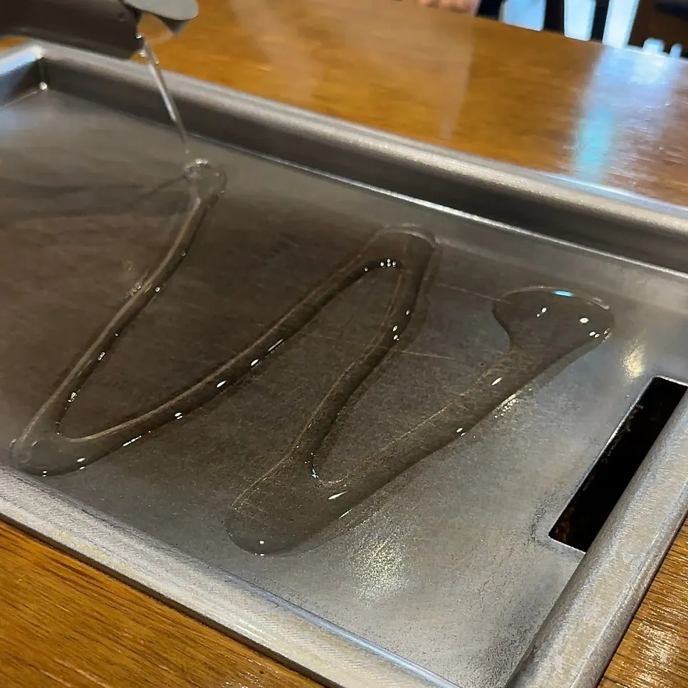 Teppan dishes set out on the table at Jojo