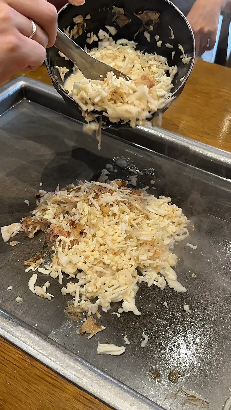 Cheese stretching from the cod roe monjayaki