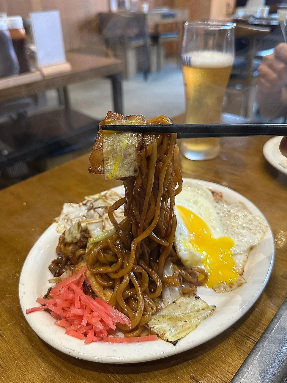 Yakisoba with the egg yolk popped