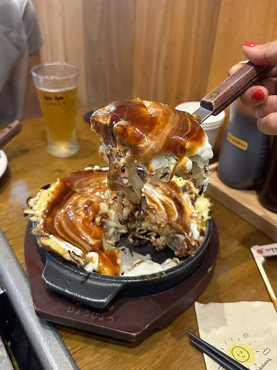 Cross-section of the okonomiyaki showing its moist texture