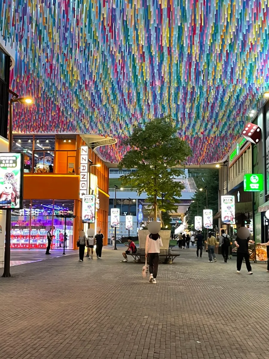 Triple Street's evening street lit up at night