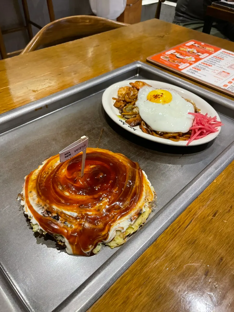 Okonomiyaki cooked golden and crisp on the outside