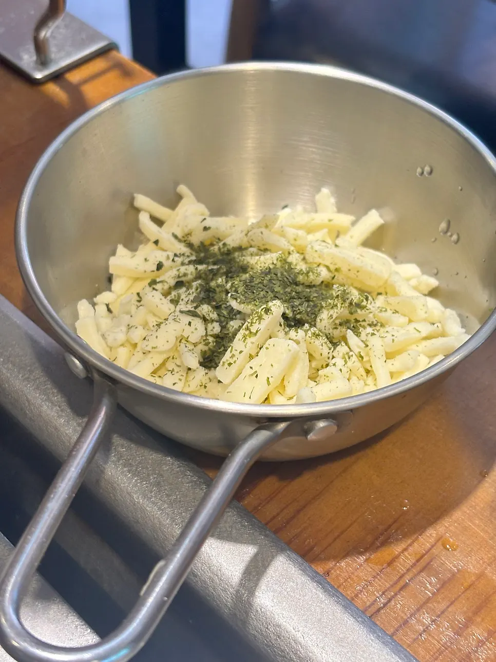 Mentaiko mochi monjayaki ingredients topped with standard cheese