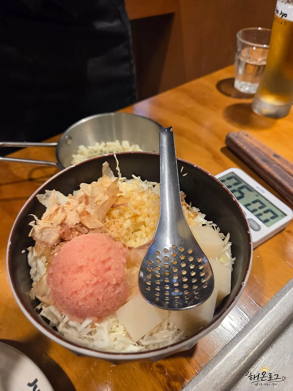 Mentaiko monjayaki ingredients on the table griddle
