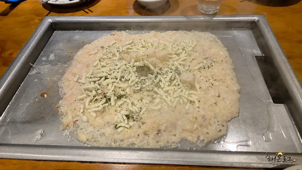 Finished mentaiko monjayaki topped with mochi and cheese