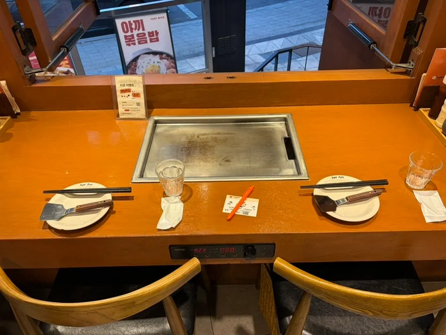 Seating at Jojo Yeonnam Branch with a griddle built into every table