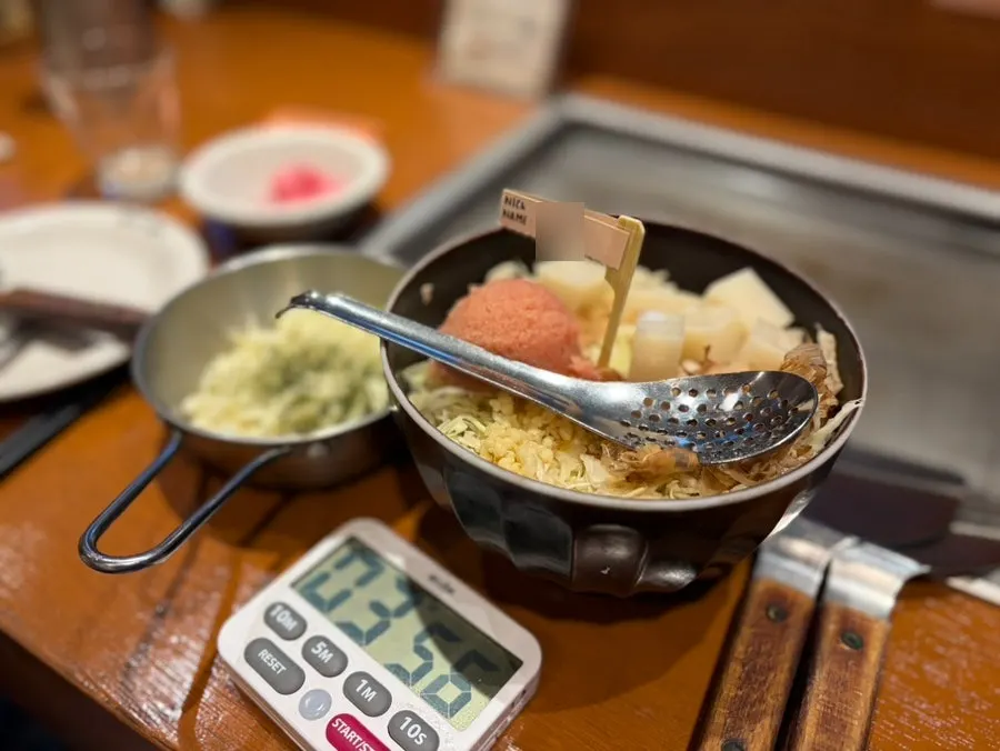 Ingredients for mentaiko monjayaki, including mentaiko and mochi