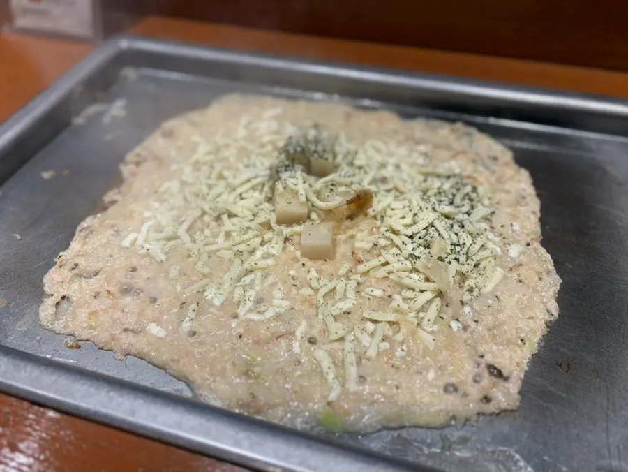 Monjayaki with stretchy, chewy mochi pulled up