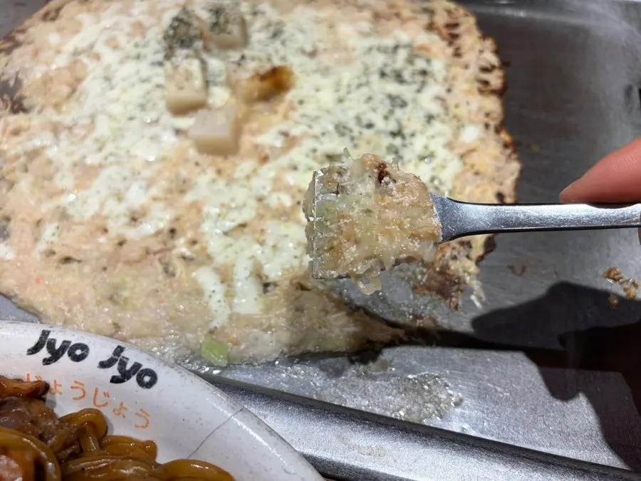 A bite-sized portion of mentaiko monjayaki