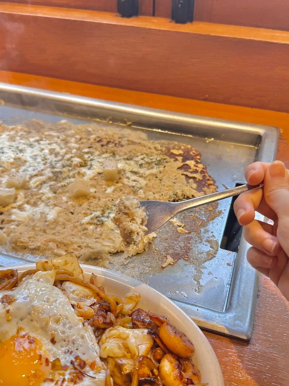 Mentaiko monjayaki cooking on the griddle
