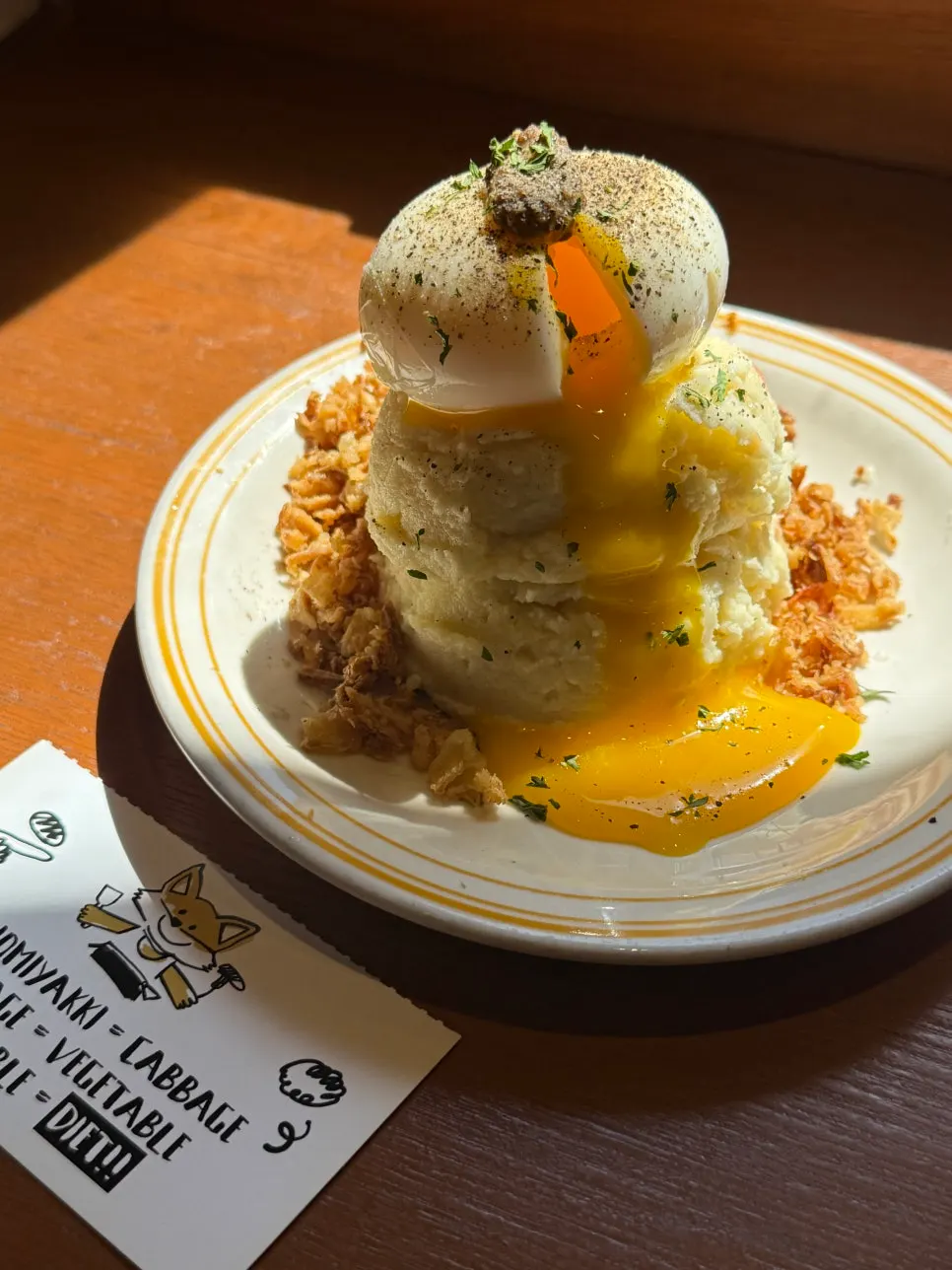 Waterfall potato topped with a soft-boiled egg