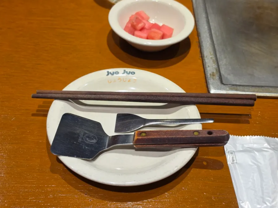 Individual plates and sauces set at each seat