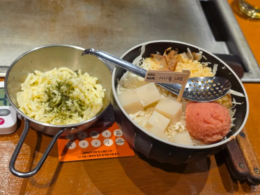 Monjayaki ingredients laid out on the griddle