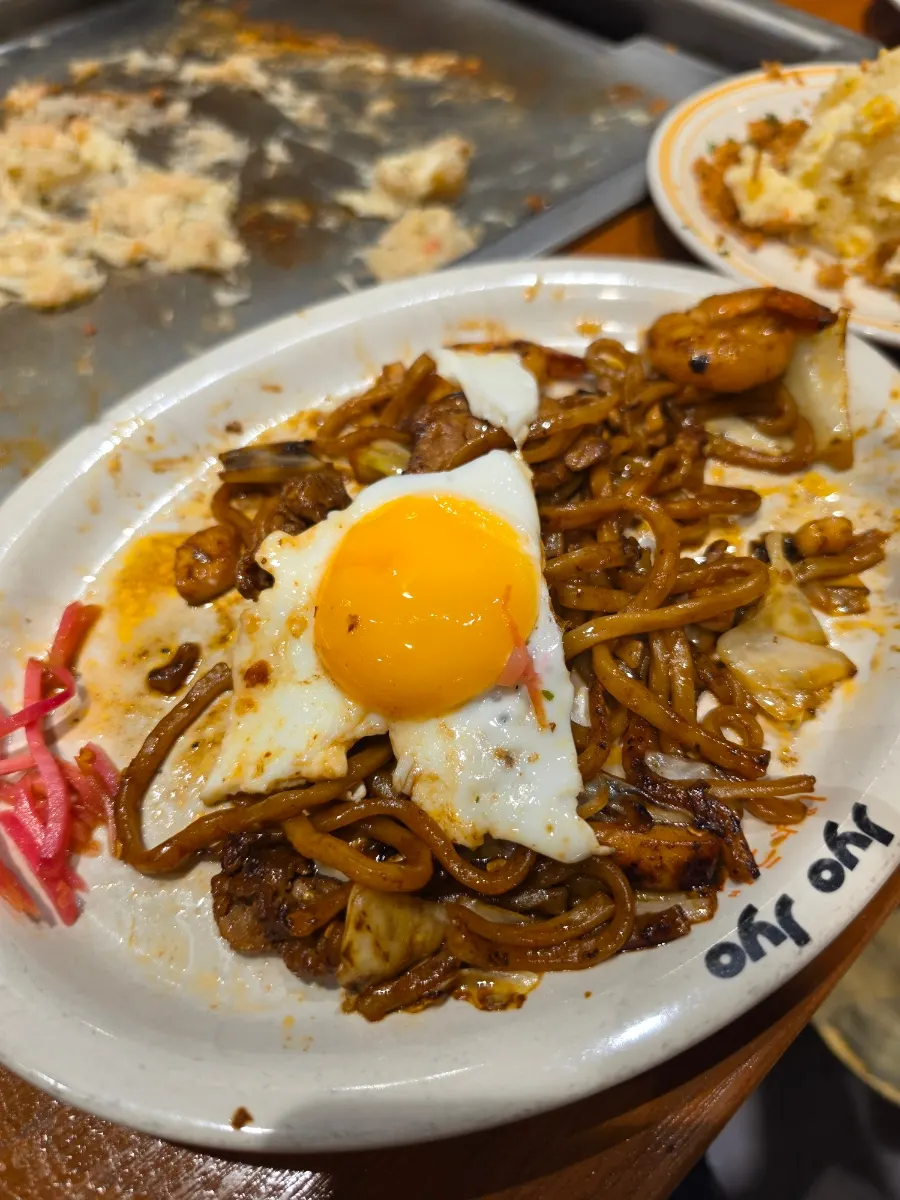 Yakisoba topped with a soft fried egg