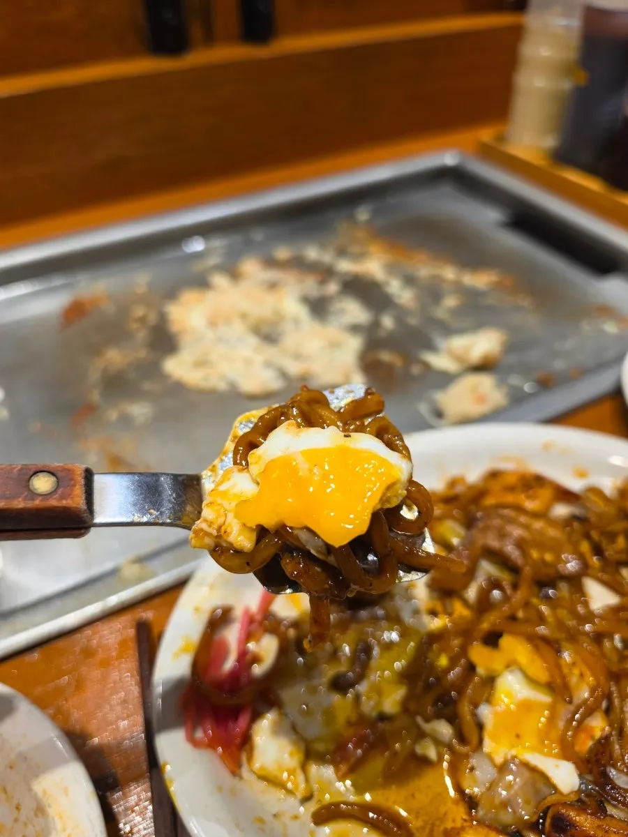 Spicy yakisoba with the yolk broken open