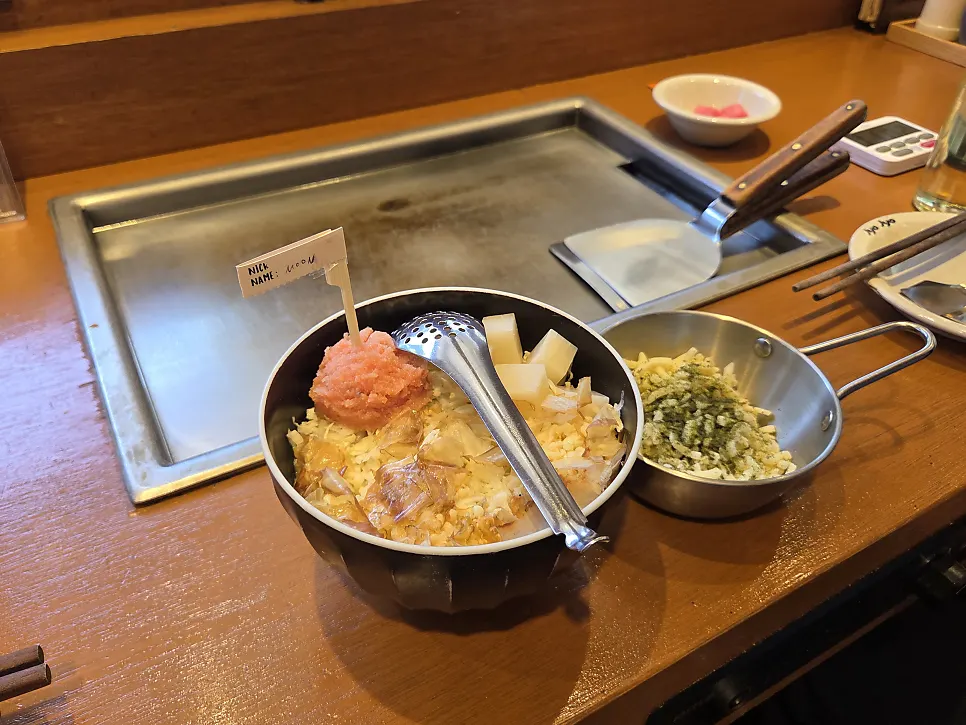 Mentaiko monjayaki batter being cooked on the griddle