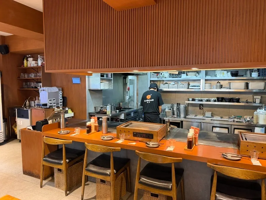 Spacious interior with tables facing each other