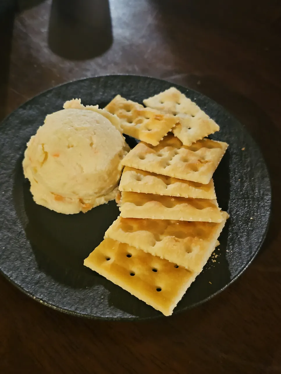 Potato salad and crackers on the table