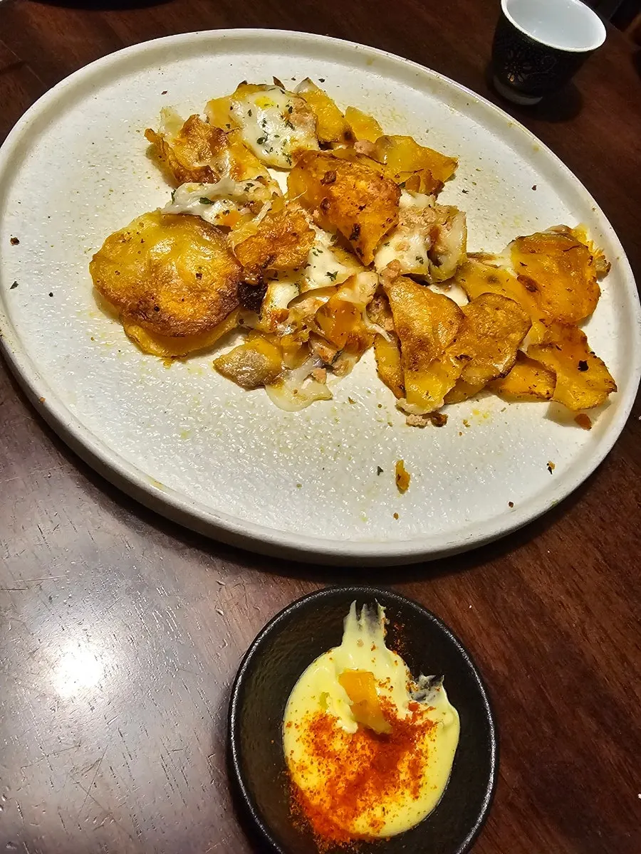 Pollock roe cheese jeon, photographed mid-bite