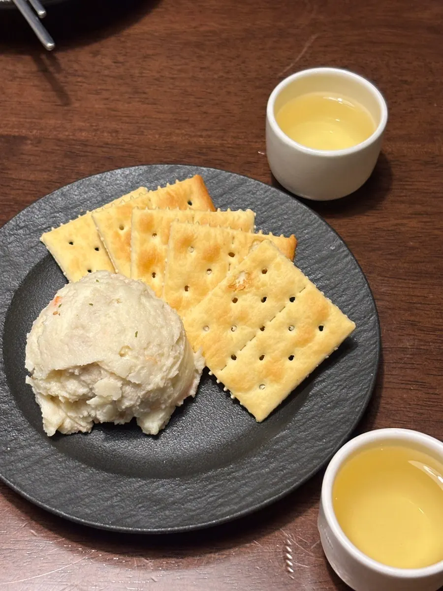 Crackers and truffle potato salad served as basic side dishes