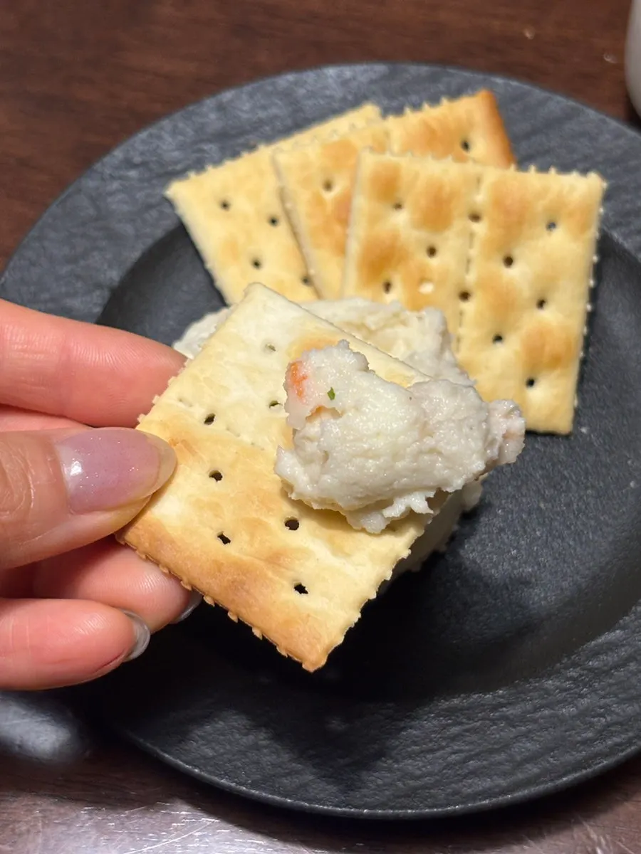 Truffle potato salad piled onto a cracker