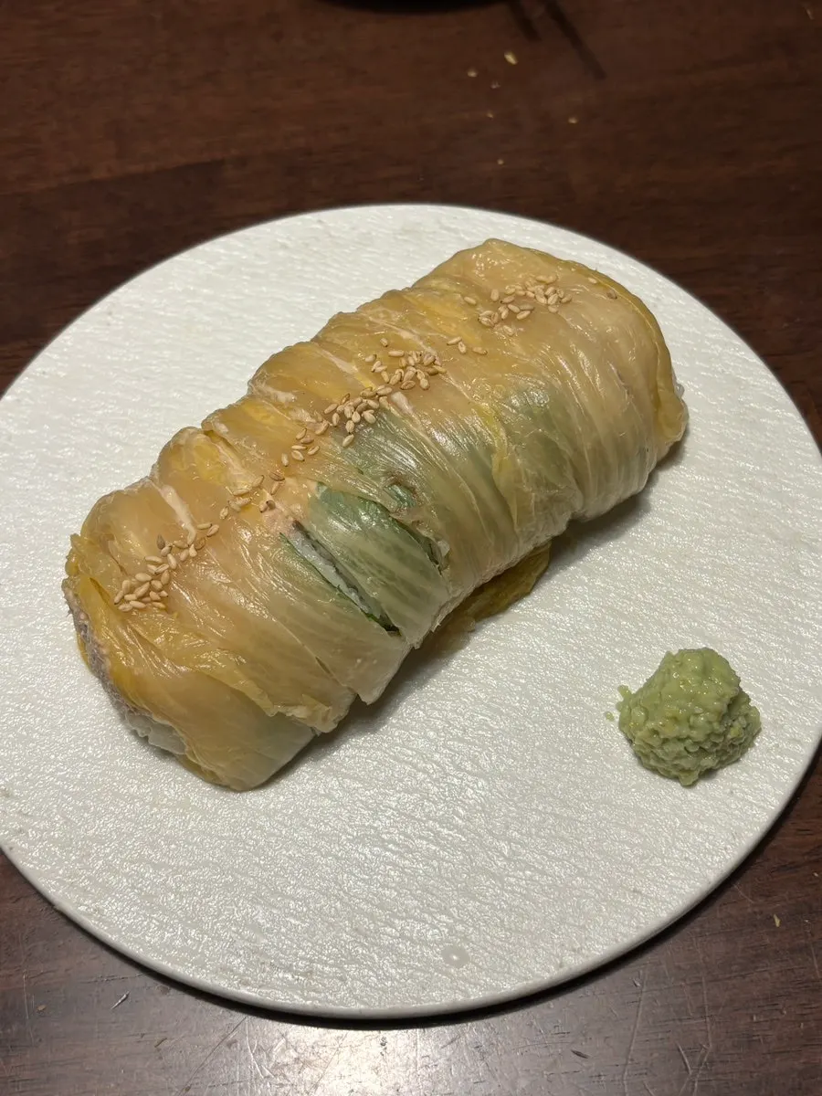 A plate of Jojomomo's tuna aged kimchi roll