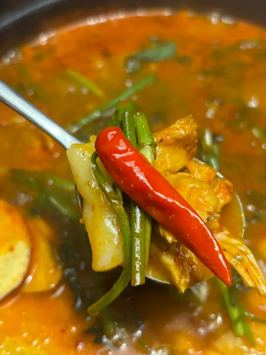 A bowl of spicy, richly simmered mul dakgalbi