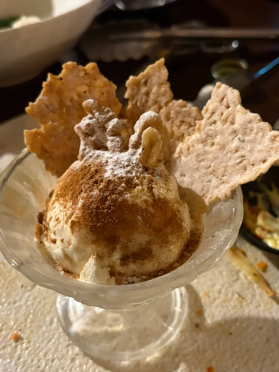Garlic dip and cheese sauce served alongside the dishes