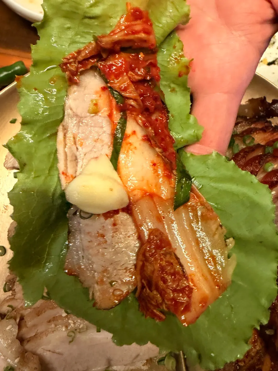 Fresh geotjeori kimchi served alongside bossam
