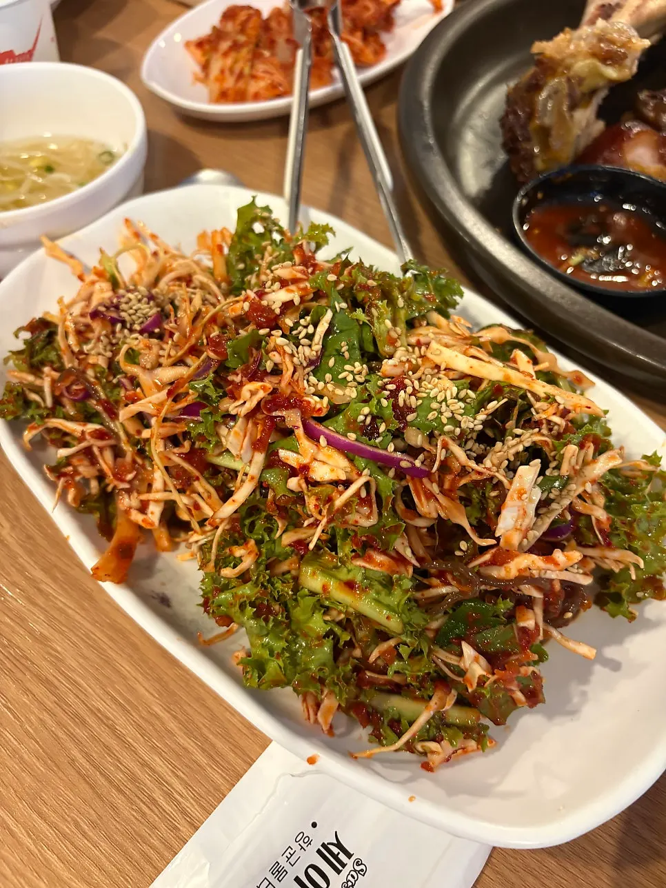 Jaengban guksu piled high with vegetables