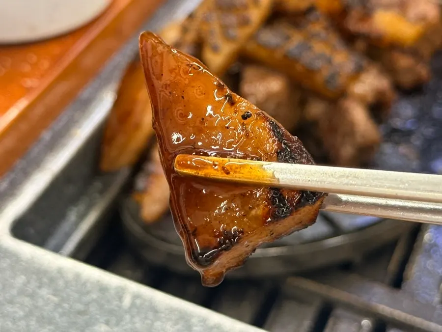 A plate of golden-brown grilled pork rind