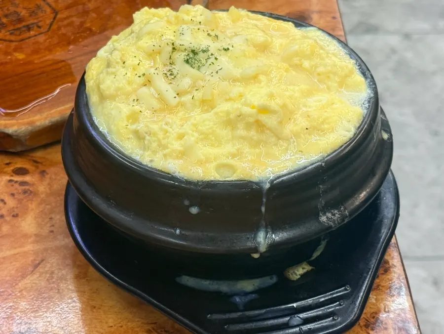 Fluffy cheese egg steamer served at the table