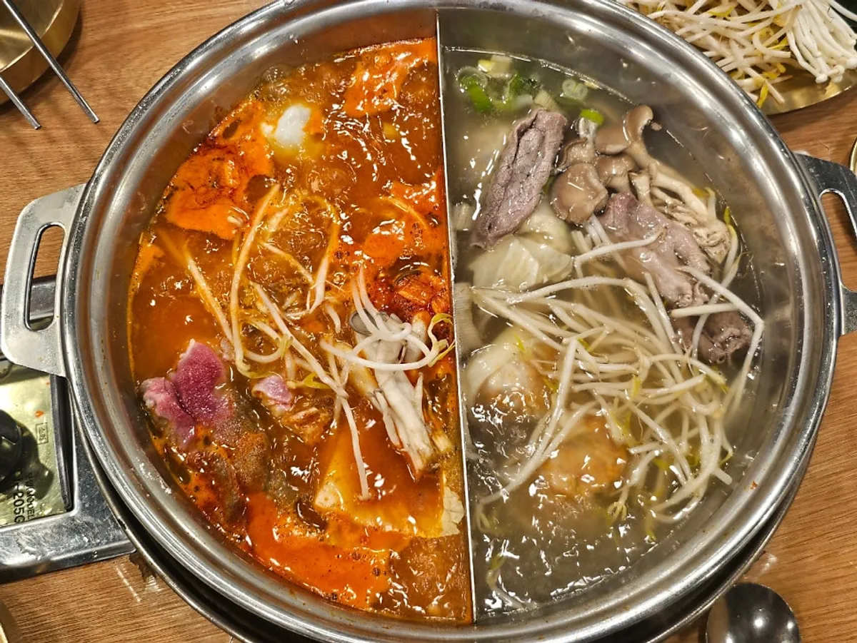 Jongga Mandu half-and-half broth hot pot boiling