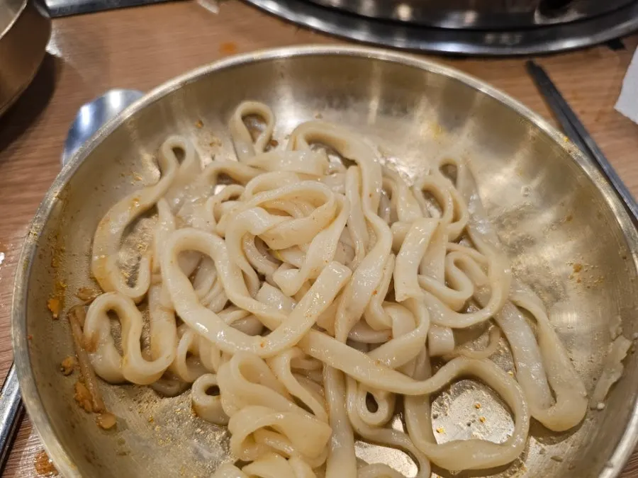 Kalguksu noodles boiled in the hot pot broth