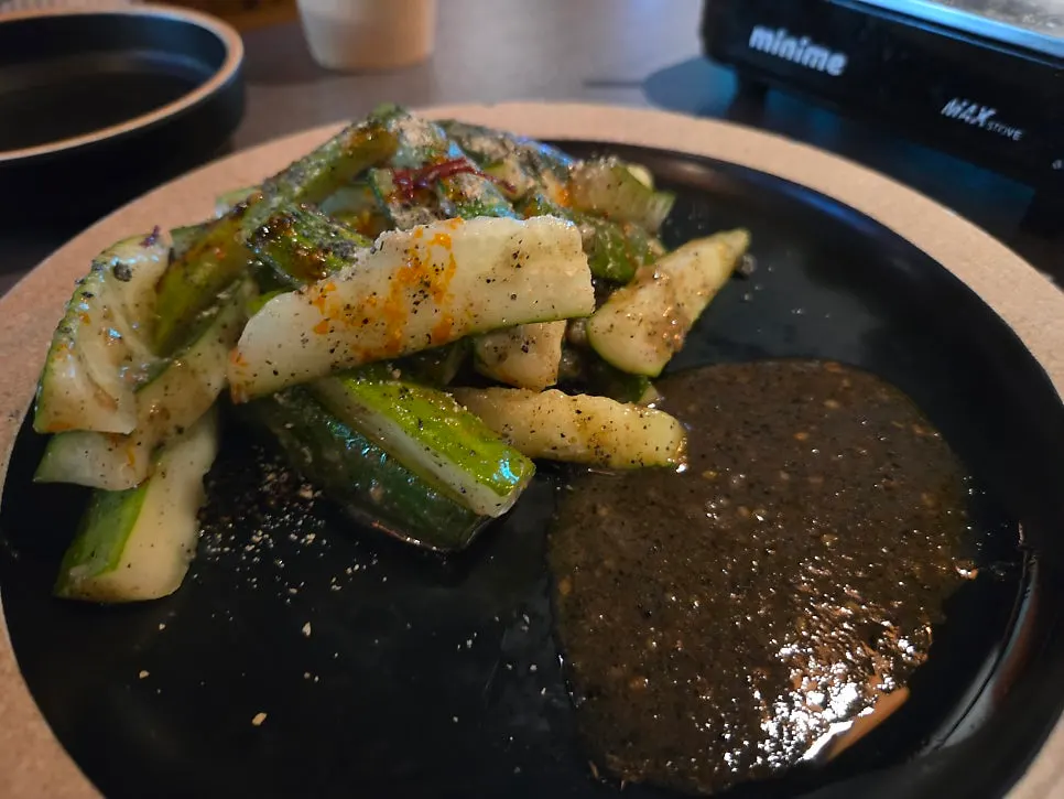 Close-up of the nutty, spicy black sesame cucumber salad