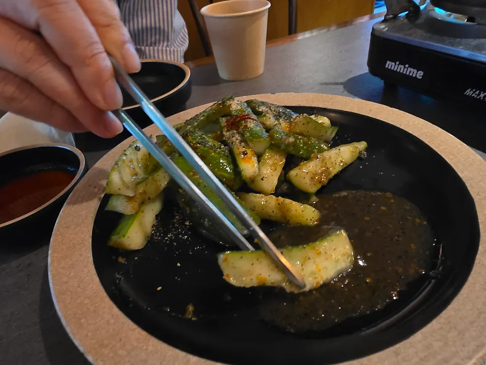 A plate of black sesame cucumber salad