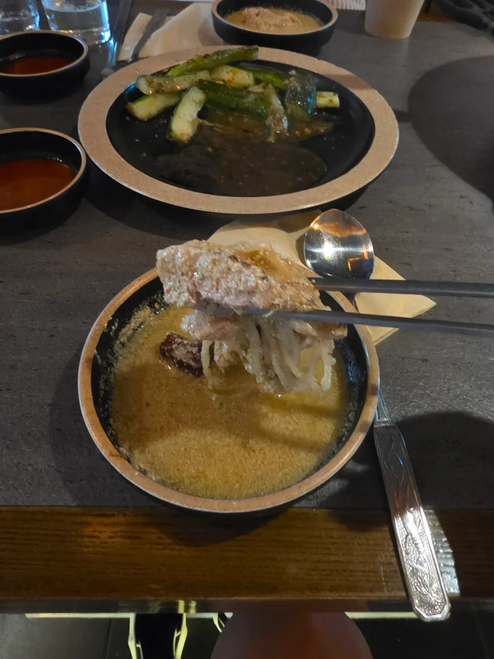 Table with the hot pot and side dishes together