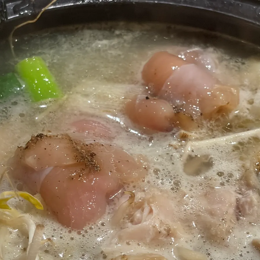 Chicken tenderloin being cooked in the hot pot