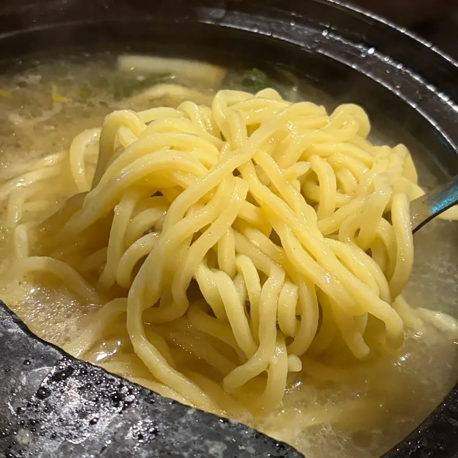Chinese-style noodles added into the hot pot broth