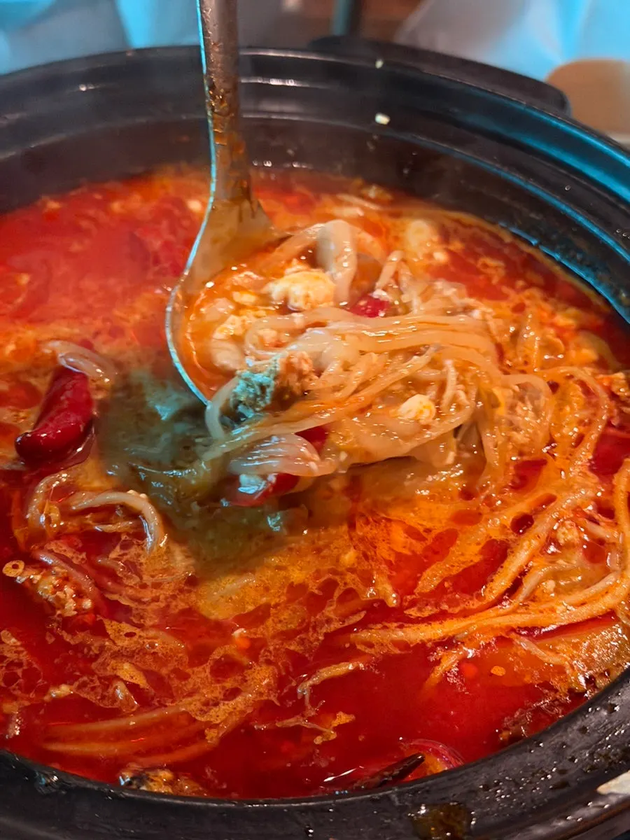 Enjoying the beef tripe soft tofu hot pot broth as anju for soju