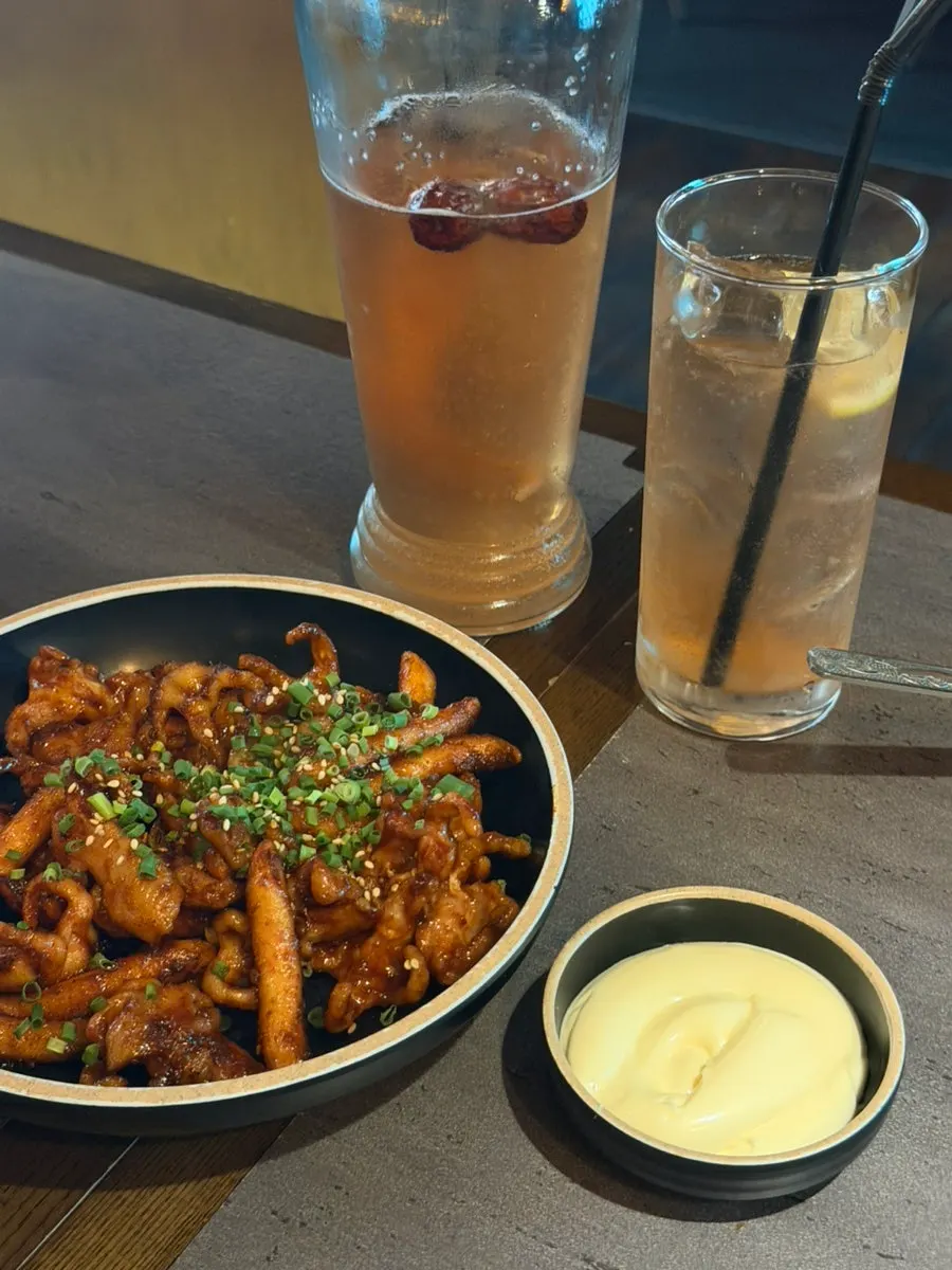 The perilla chicken hot pot and rice cake chicken feet stir-fry served together