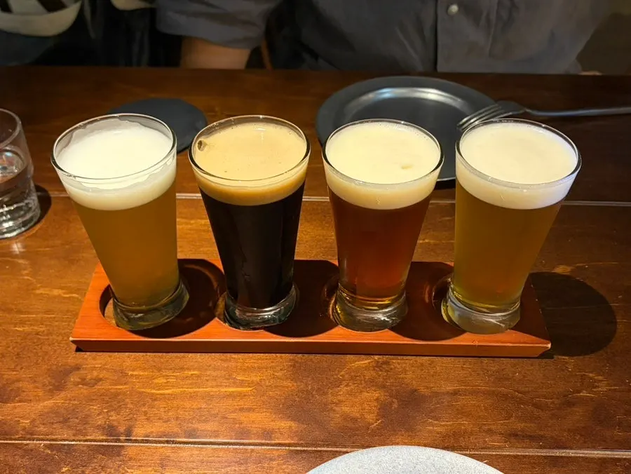 Beer sampler with witbier, pale ale, ale, and stout