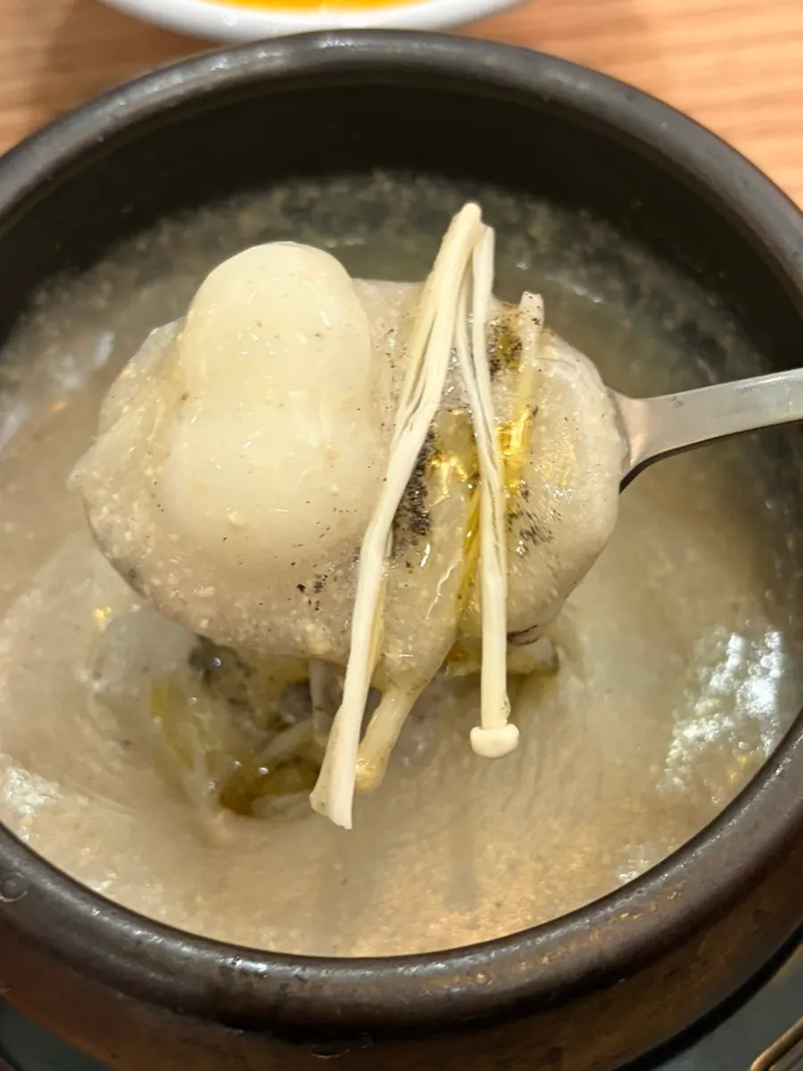 A spoonful of octopus stir-fry with rice