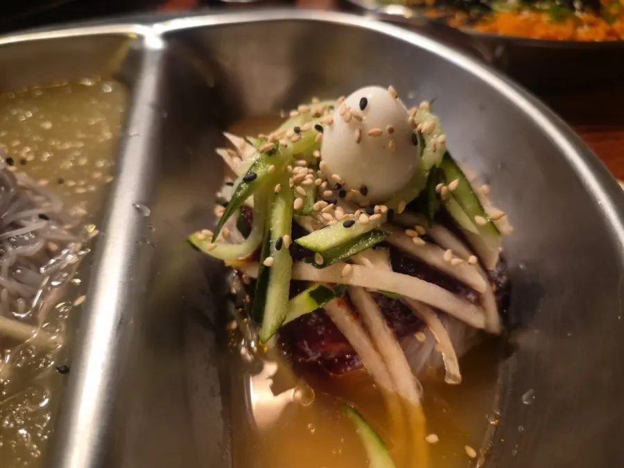 Bibim naengmyeon eaten with meat