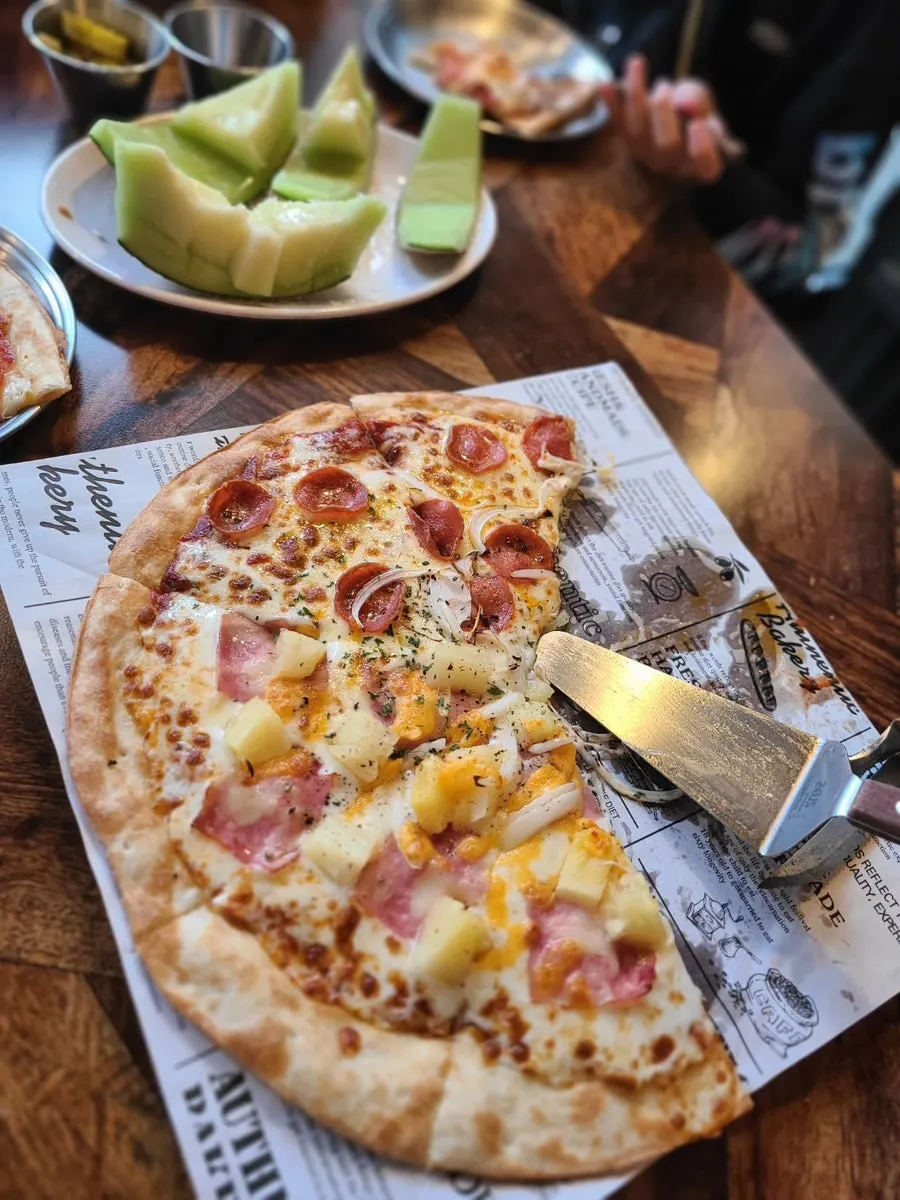A slice of pizza easy to share with a kid
